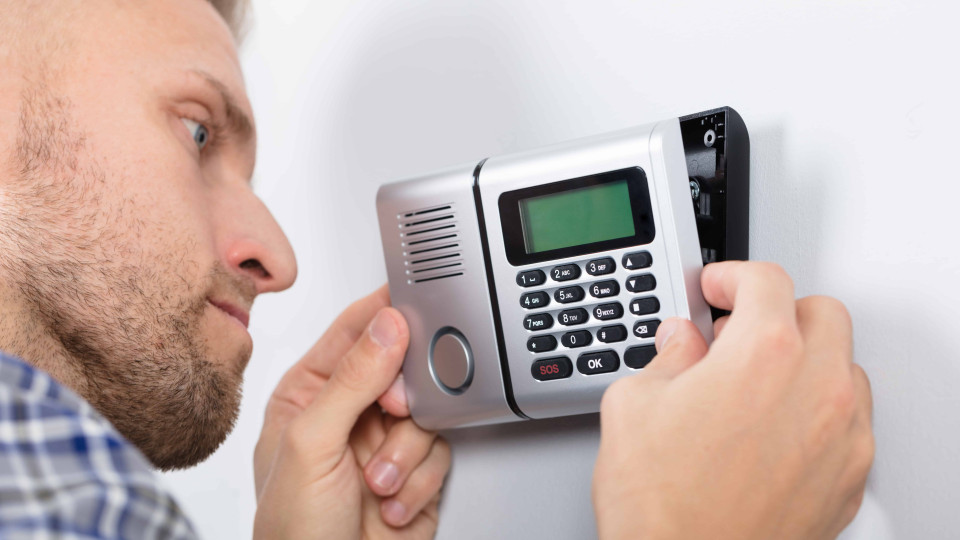 Repairman Installing Security System